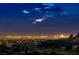 Striking Las Vegas city view featuring the skyline and a golf course at dusk at 2786 Scotts Valley Dr, Henderson, NV 89052