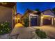 Home exterior showcasing a three-car garage with a textured driveway and walkway at 2786 Scotts Valley Dr, Henderson, NV 89052