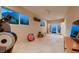 Bright and airy gym with tile flooring and access to outdoor patio, perfect for exercising at 2786 Scotts Valley Dr, Henderson, NV 89052