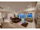 Spacious living room with tile flooring, modern furniture, and sliding glass doors to the outdoors at 2786 Scotts Valley Dr, Henderson, NV 89052