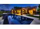 Stunning backyard pool and spa with covered patio, perfect for evening relaxation and entertaining at 2786 Scotts Valley Dr, Henderson, NV 89052