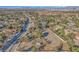 Aerial view of the equestrian facilities, and lush landscaping, with the city skyline in the distance at 2868 Vista Del Sol Ave, Las Vegas, NV 89120