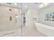 Elegant bathroom with sleek shower, modern tub, and natural light offers a spa-like experience at 2868 Vista Del Sol Ave, Las Vegas, NV 89120
