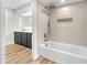 Bathroom featuring a soaking tub, stylish tile accents, and a vanity with modern lighting at 2868 Vista Del Sol Ave, Las Vegas, NV 89120