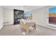 Comfortable bedroom offers natural light, modern fireplace, and access to outdoor balcony at 2868 Vista Del Sol Ave, Las Vegas, NV 89120