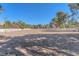 Spacious equestrian field with white perimeter fencing, ideal for riding and training horses on a horse property at 2868 Vista Del Sol Ave, Las Vegas, NV 89120