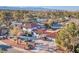 Expansive home showcasing a red tile roof, lush landscaping, and a driveway leading to multiple garages at 2868 Vista Del Sol Ave, Las Vegas, NV 89120