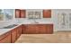 Bright kitchen features modern appliances, wood cabinets, white countertops, and wood-look flooring at 2868 Vista Del Sol Ave, Las Vegas, NV 89120