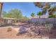 Spacious backyard features a covered patio, dining set, and fence at 3129 White Rose Way, Henderson, NV 89014