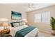 Bedroom staged with stylish furniture, a ceiling fan, and an abundance of natural light at 3129 White Rose Way, Henderson, NV 89014