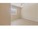 Bright bedroom features a ceiling fan and tiled floors at 3129 White Rose Way, Henderson, NV 89014