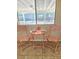 Close up of dining area next to a window with seating for two, perfect for enjoying a meal at 3129 White Rose Way, Henderson, NV 89014