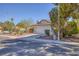 Lovely single-story house showcasing a landscaped front yard and attached two-car garage at 3129 White Rose Way, Henderson, NV 89014