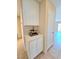 Entryway cabinet and decor, perfect for storage and display with hallway and living room views at 3129 White Rose Way, Henderson, NV 89014