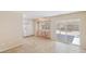Bright kitchen and dining area with tile floors and stainless steel refrigerator, and backyard access at 3129 White Rose Way, Henderson, NV 89014