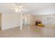Open-concept living area with fireplace, tile flooring, and plenty of natural light at 3129 White Rose Way, Henderson, NV 89014