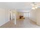 Expansive living room featuring tile floors and a cozy fireplace at 3129 White Rose Way, Henderson, NV 89014