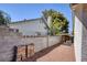 Side yard is enclosed with block fence and gravel ground cover at 3129 White Rose Way, Henderson, NV 89014