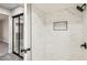 Updated bathroom featuring a tiled walk-in shower and modern fixtures at 3310 Heritage Pl, Las Vegas, NV 89121