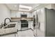 Modern kitchen featuring stainless steel appliances, granite countertops, and ample cabinet space at 3310 Heritage Pl, Las Vegas, NV 89121
