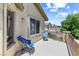 Charming balcony with seating and a view of the neighborhood and blue skies at 3405 Brook Song Ave, North Las Vegas, NV 89081