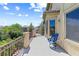 Relaxing balcony with comfortable seating and scenic views of the surrounding neighborhood at 3405 Brook Song Ave, North Las Vegas, NV 89081