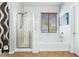 Bathroom with a glass shower, soaking tub, and tile floors at 3405 Brook Song Ave, North Las Vegas, NV 89081