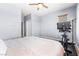 Spacious bedroom with a comfortable bed, exercise bike, and modern lighting fixtures at 3405 Brook Song Ave, North Las Vegas, NV 89081