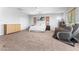 Bedroom with a bed, dresser, seating area, and blinds on the window at 3405 Brook Song Ave, North Las Vegas, NV 89081