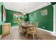 Dining room features hardwood floors, designer paint, and a large window for plenty of light at 3405 Brook Song Ave, North Las Vegas, NV 89081