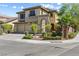 Inviting two-story home boasts a three-car garage and meticulous desert landscaping at 3405 Brook Song Ave, North Las Vegas, NV 89081