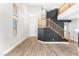 Spacious foyer showcases wood flooring, a staircase, and ample natural light at 3405 Brook Song Ave, North Las Vegas, NV 89081