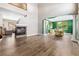 Open-concept living space with a fireplace and adjacent formal dining area at 3405 Brook Song Ave, North Las Vegas, NV 89081