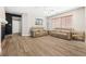 Inviting living room showcasing hardwood floors, comfortable furniture, and natural light at 3405 Brook Song Ave, North Las Vegas, NV 89081