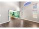 Spacious living room boasts hardwood floors, high ceilings, and lots of natural light at 3405 Brook Song Ave, North Las Vegas, NV 89081
