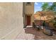 Cozy outdoor patio features brick pavers, a fire pit, seating and shade at 3405 Brook Song Ave, North Las Vegas, NV 89081