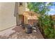 Cozy outdoor patio features brick pavers, a fire pit, seating and shade at 3405 Brook Song Ave, North Las Vegas, NV 89081