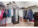 Organized walk-in closet with shelving and hanging space for efficient storage solutions at 3405 Brook Song Ave, North Las Vegas, NV 89081