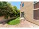 The backyard has lush landscaping and a charming stone accent, perfect for peaceful relaxation at 3425 Yorkminster St, Las Vegas, NV 89129