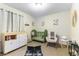 Inviting Bedroom with a green crib, rocking chair, and whimsical decor at 3425 Yorkminster St, Las Vegas, NV 89129