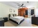 This cozy bedroom features a modern ceiling fan, carpet, and warm color palette at 3425 Yorkminster St, Las Vegas, NV 89129