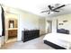 Bright bedroom with a ceiling fan, adjacent bathroom, and neutral color scheme at 3425 Yorkminster St, Las Vegas, NV 89129