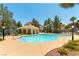 The community pool features ample lounge chairs, shaded areas, and well-maintained landscaping at 3425 Yorkminster St, Las Vegas, NV 89129