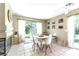 Cozy dining area with access to a patio, a fireplace, and natural light at 3425 Yorkminster St, Las Vegas, NV 89129