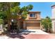 Charming two-story home with a desert landscape and a two car garage at 3425 Yorkminster St, Las Vegas, NV 89129