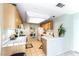 Functional kitchen featuring ample counter space, appliances, and adjacent laundry area at 3425 Yorkminster St, Las Vegas, NV 89129