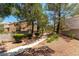 A community walking path is lined with mature trees and lush landscaping, creating a serene environment at 3425 Yorkminster St, Las Vegas, NV 89129