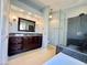 Bright bathroom with sleek vanity, glass shower, and modern fixtures at 3523 Calf Roper Ct, North Las Vegas, NV 89032