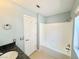 This bathroom features a shower and tub combination at 3523 Calf Roper Ct, North Las Vegas, NV 89032