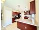 Bright kitchen featuring granite countertops, a breakfast bar, and modern appliances at 3523 Calf Roper Ct, North Las Vegas, NV 89032